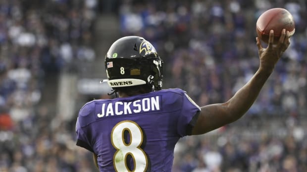 Nov 7, 2021; Baltimore, Maryland, USA; Baltimore Ravens quarterback Lamar Jackson (8) throws in over time against the Minnesota Vikings at M&amp;T Bank Stadium. Mandatory Credit: Tommy Gilligan-USA TODAY Sports